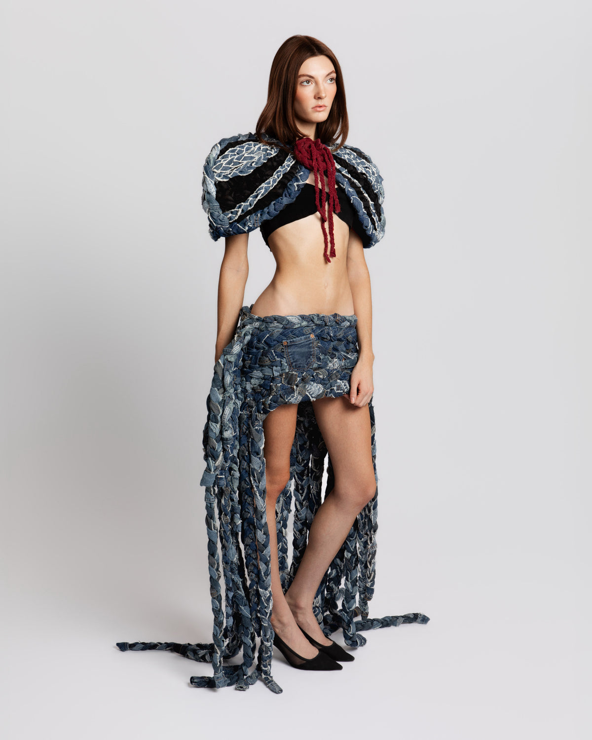 KROMANOX ART001 Braided Bloom Cape and ART002 Braided Bloom Skirt three-quarter view showing layered braided denim construction