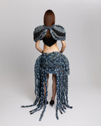 Back view of KROMANOX ART001 Braided Bloom Cape and ART002 Braided Bloom Skirt with hand-braided reconstructed denim