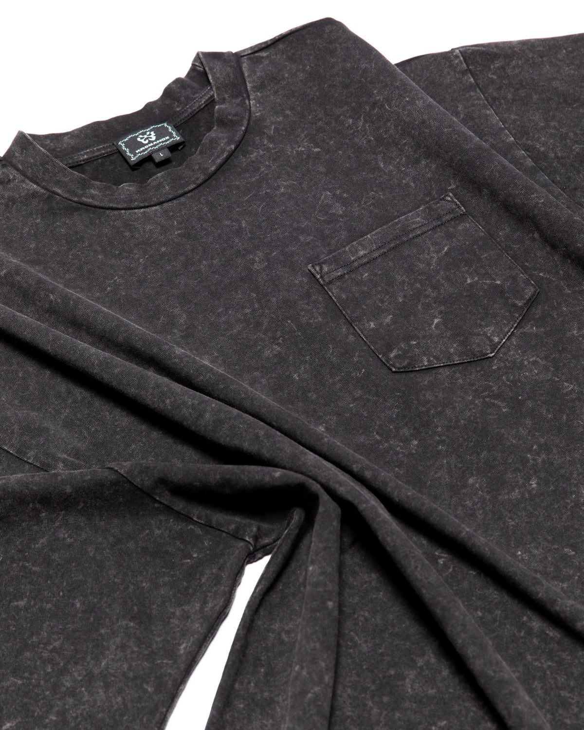 Close-up of heavyweight 7.5 oz cotton fabric and acid-washed cotton texture on KROMANOX SPC012 Bloom Trace T-shirt