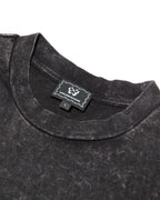 Close-up of KROMANOX woven label on SPC012 Bloom Trace heavyweight acid-wash T-shirt