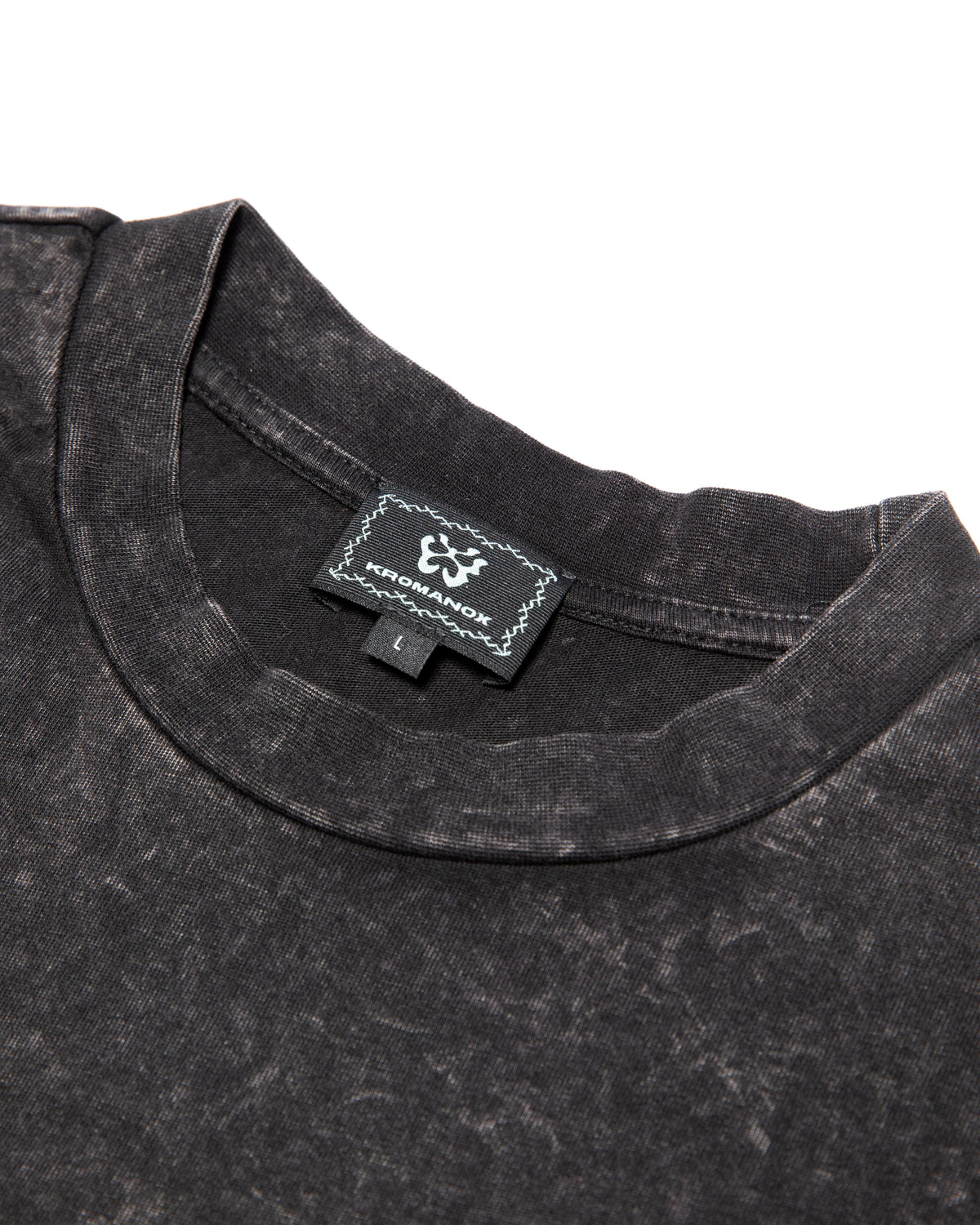 Close-up of KROMANOX woven label on SPC012 Bloom Trace heavyweight acid-wash T-shirt